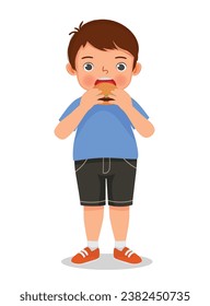 Cute fat obese little boy feel hungry eating hamburger junk food