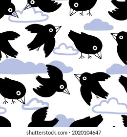 Cute flat ravens and clouds. Abstract hand drawn vector seamless pattern. Colored cartoon ornament with birds. Funny modern design for print, fabric, textile, background, wallpaper, wrap, card, decor.