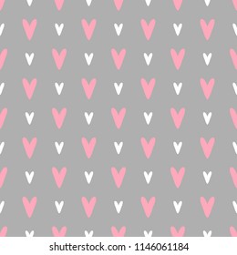 Cute flat seamless vector pattern with pink and white hand drawn hearts on grey background