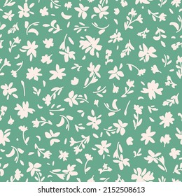 Cute floral minimal seamless repeat pattern. Random placed, vector flowers all over print on pastel green background.