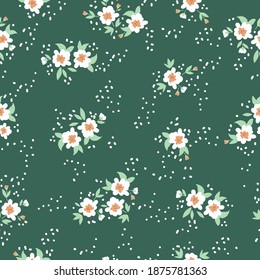 Cute floral pattern of the plants . Printing color in a flower. Seamless vector texture. Beautiful white flowers. Green background. elegant template for fashionable prints.
