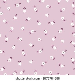 Patrón floral lindo de las plantas. Imprimiendo color en una flor. Textura vectorial sin inconvenientes. Pequeñas flores blancas. fondo rosa pálido. elegante plantilla para impresiones de moda.