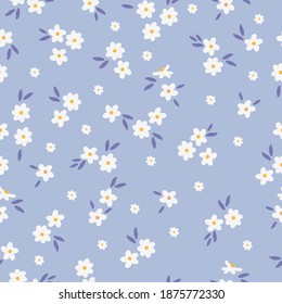 Cute floral pattern . Printing color in a flower. Seamless vector texture. White flowers . Pale blue background. elegant template for fashionable prints.