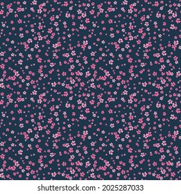 Cute floral pattern. Seamless vector pattern. Elegant template for fashion prints. Small pink flowers for print. Dark blue background. Stock vector.