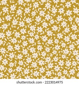 Cute floral pattern. Seamless vector texture. An elegant template for fashionable prints. Print with white flowers and leaves . mustard background.