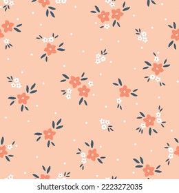 Cute floral pattern. Seamless vector texture. An elegant template for fashionable prints. Print with white and orange  flowers and dark blue leaves . orange background.