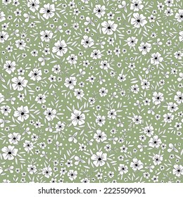 Cute floral pattern. Seamless vector texture. An elegant template for fashionable prints. Print with small white flowers and  leaves,black outline. green  background.