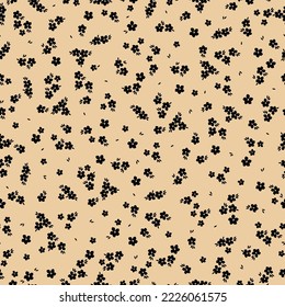 Cute floral pattern. Seamless vector texture. An elegant template for fashionable prints. Print with small black flowers and  leaves. beige background.