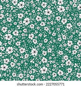 Cute floral pattern. Seamless vector texture. An elegant template for fashionable prints. Print with white flowers and leaves, black outline. green background.