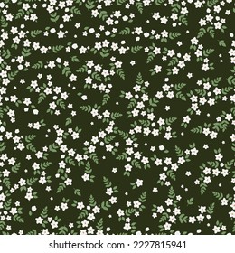 Cute floral pattern. Seamless vector texture. An elegant template for fashionable prints. Print with small white flowers, green leaves. dark green  background.