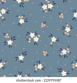 Cute floral pattern. Seamless vector texture. An elegant template for fashionable prints. Print with white and yellow flowers . blue background.