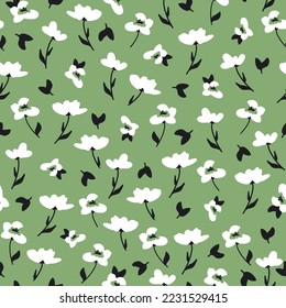 Cute floral pattern. Seamless vector texture. An elegant template for fashionable prints. Print with white flowers and black leaves. green background.