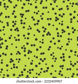 Cute floral pattern. Seamless vector texture. An elegant template for fashionable prints. Print with small black flowers . lime background.