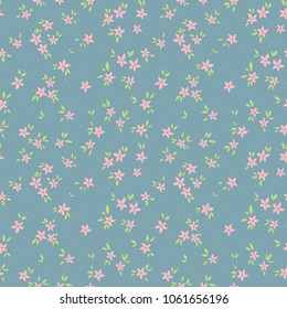 Cute floral pattern in the small flower. Ditsy print. Motifs scattered random. Seamless vector texture. Elegant template for fashion prints. Printing with small pink flowers. Light blue background.