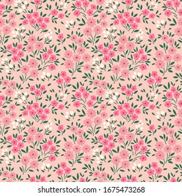 Cute floral pattern in the small flower. Ditsy print. Motifs scattered random. Seamless vector texture. Elegant template for fashion prints. Printing with small pink flowers. Pale pink background.