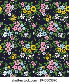 Cute floral pattern in the small flower. Seamless vector texture. Elegant template for fashion prints. Printing with small colorful flowers. Dark blue background. Stock print.