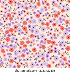 Cute floral pattern in the small flower. Seamless vector texture. Elegant template for fashion prints. Printing with small orange and lilac flowers. Ivory background. Stock print.