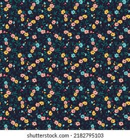 Cute floral pattern in the small flower. Seamless vector texture. Elegant template for fashion prints. Printing with small colorful flowers. Dark blue background. Stock print.