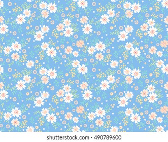 Cute Floral pattern in the small flower. "Ditsy print". Motifs scattered random. Seamless vector texture. Elegant template for fashion prints. Printing with very small white flowers. Blue background.