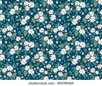 Cute Floral pattern in the small flower. "Ditsy print". Motifs scattered random. Seamless vector texture. Elegant template for fashion prints. Printing with very small white flowers. Blue background.