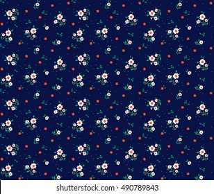 Cute Floral pattern in the small flower. "Ditsy print". Motifs scattered random. Seamless vector texture. Elegant template for fashion prints. Printing with very small white flowers. Blue background.