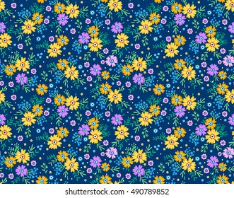 Cute Floral pattern in the small flower. "Ditsy print". Motifs scattered random. Seamless vector texture. Elegant template for fashion prints. Printing with small colorful flowers. Blue background.