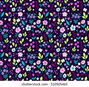 Cute Floral pattern in the small flower. "Ditsy print". Seamless vector texture. Elegant template for fashion prints. Printing with very small colorful flowers. Purple background.