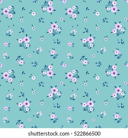 Cute Blumenmuster in der kleinen Blume. "Ditsy print". Motive verstreut nach dem Zufallsprinzip.Nahtlose Vektorstruktur. Elegante Vorlage für Modedrucke. Drucken mit sehr kleinen rosa Blumen. Blauer Hintergrund.