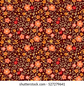 Cute Floral pattern in the small flower. "Ditsy print". Motifs scattered random. Seamless vector texture. Elegant template for fashion prints. Printing with small orange flowers. Brown background.