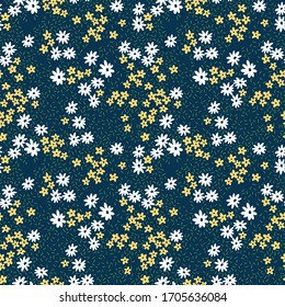 Cute floral pattern in the small flowers. Ditsy print. Seamless vector texture. Elegant template for fashion prints. Printing with small white and yellow flowers. Dark blue background.