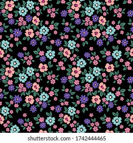 Cute floral pattern in the small flowers. Ditsy print. Seamless vector texture. Elegant template for fashion prints. Printing with small blue and pink flowers. Black background.