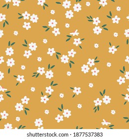 Patrón floral lindo de flores pequeñas. Imprimiendo color en una flor. Textura vectorial sin inconvenientes. Pequeñas flores blancas. Fondo naranja. diseño elegante para impresiones de moda.