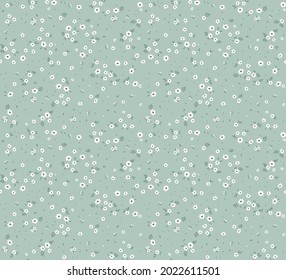 Cute floral pattern in the small flowers. Seamless vector texture. Elegant template for fashion prints. Printing with small white flowers. Pale blue gray  background.