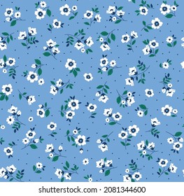 Cute floral pattern in the small flowers. Seamless vector texture. Elegant template for fashion prints. Printing with small white flowers. Pale blue background.