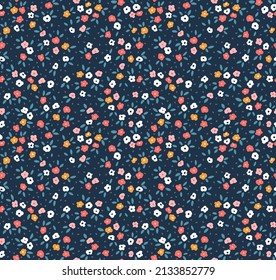 Cute floral pattern in the small flowers. Seamless vector texture. Elegant template for fashion prints. Printing with small colorful flowers. Dark blue background. Stock vector for prints on surface.