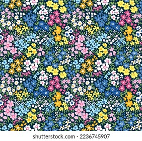 Cute floral pattern in small flowers. Small colorful flowers. Dark blue background. Ditsy print. Floral seamless background. Liberty template for fashion prints. Stock pattern.