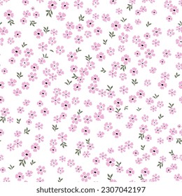 Cute floral pattern of small flowers. Seamless vector texture. An elegant template for fashionable prints. Very small pink flowers on a white background.