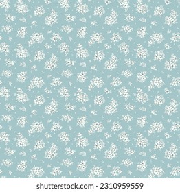 Cute floral pattern in the small flowers. Seamless vector texture. Elegant template for fashion prints. Printing with small white flowers. Light blue background. Stock print.