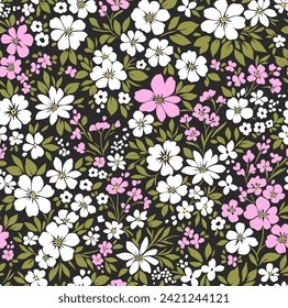 Cute floral pattern in the small flowers. Seamless vector texture. Delicate template for fashion prints. Printing with small wildflowers. Black background. Stock print.