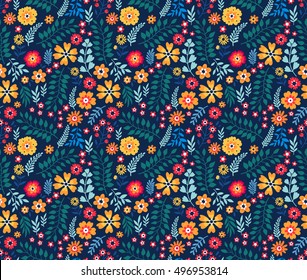 Cute Floral pattern of small flowers. "Ditsy print". Seamless vector texture. Elegant template for fashion prints. Very small colorful flowers on dark blue background.
