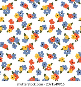 Cute floral print, seamless pattern with small flowers and leaves. Liberty composition with red, blue and yellow flowers on a white background. Modern background with simple small flower heads. Vector