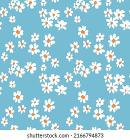 Cute floral print, seamless pattern with hand-drawn daisies on a blue background. Ditsy surface design with simple white flowers. Vector illustration.