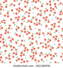 Cute flower pattern in a small flower. Elegant template for fashionable prints. Print with small orange coral flowers. White background.