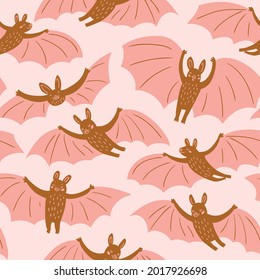 Cute flying bats in different poses. Vector hand-drawn seamless pattern design for fabric, wallpaper or wrapping paper. Kids print pink pastel colors.