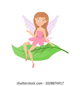 Cute forest fairy sitting on green leaf. Adorable girl with cute elf ears and little wings dressed in fancy pink dress. Fairytale creature. Colorful flat vector design