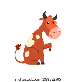 Cute friendly brown spotted cow cartoon character sitting on the ground vector Illustration on a white background