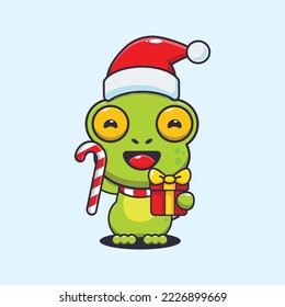 Cute frog holding christmas candy and gift. Cute christmas cartoon illustration.