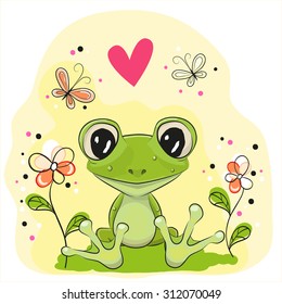 Cute Frog is sitting on the meadow with flowers