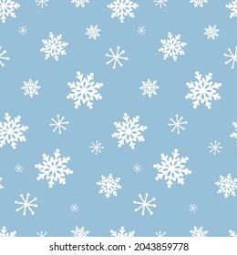 Cute frozen seamless pattern. Hand drawn snowflakes background. Snowfall backdrop. Christmas and winter decorative pattern for scrapbooking, fabric, wrapping paper or cards.  Vector illustration.