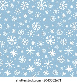 Cute frozen seamless pattern. Hand drawn snowflakes background. Snowfall backdrop. Christmas and winter decorative pattern for scrapbooking, fabric, wrapping paper or cards.  Vector illustration.